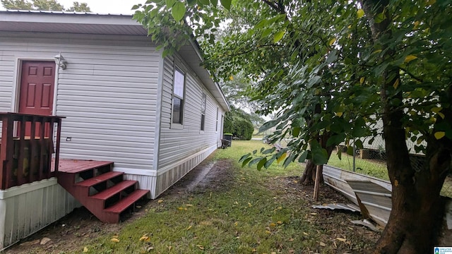 view of property exterior featuring a lawn