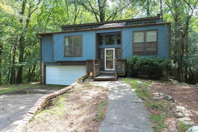 bi-level home featuring a garage