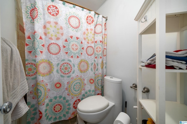 bathroom featuring walk in shower, vanity, and toilet