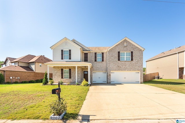 traditional-style home featuring cooling unit, driveway, brick siding, a front yard, and a garage