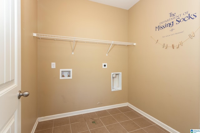 laundry room featuring hookup for an electric dryer, washer hookup, and dark tile patterned floors