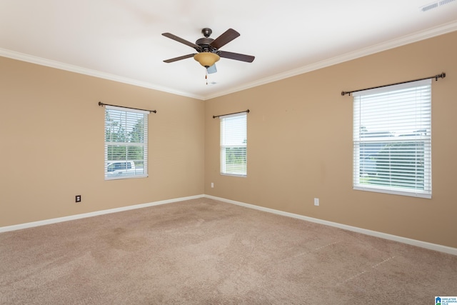 empty room with light carpet, ceiling fan, and a wealth of natural light