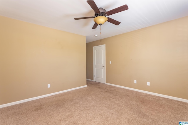 empty room with ceiling fan and carpet flooring