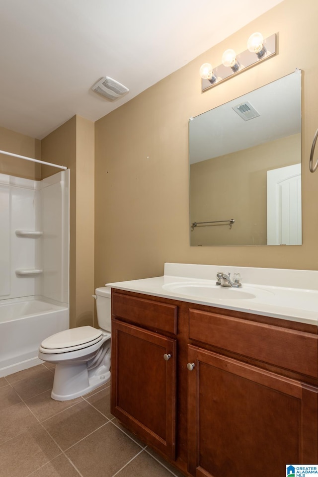 full bathroom with shower / tub combination, vanity, toilet, and tile patterned floors