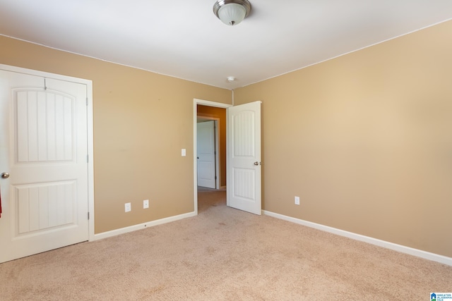 spare room with light colored carpet