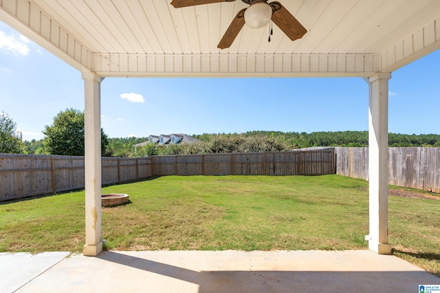 view of yard featuring a patio and ceiling fan