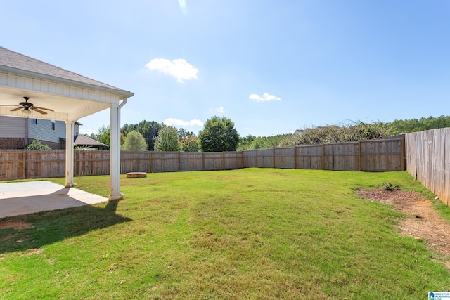 view of yard featuring ceiling fan and a patio area