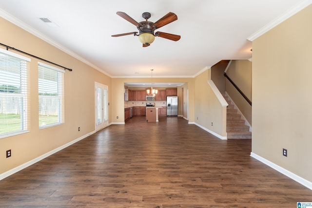 unfurnished living room with ceiling fan with notable chandelier, dark hardwood / wood-style floors, and crown molding