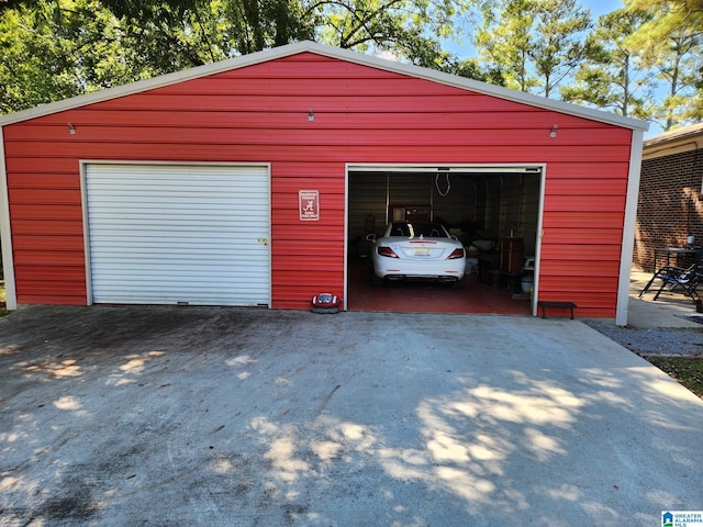 garage featuring wood walls