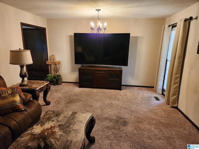 living room featuring carpet floors, an inviting chandelier, and a textured ceiling