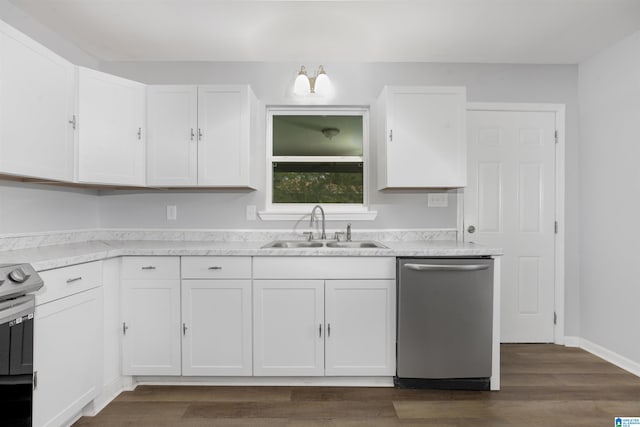 kitchen with white cabinets, appliances with stainless steel finishes, dark hardwood / wood-style floors, and sink