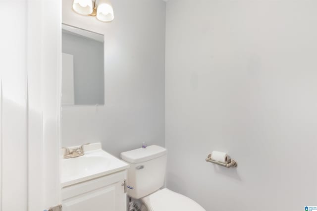 bathroom with vanity and toilet