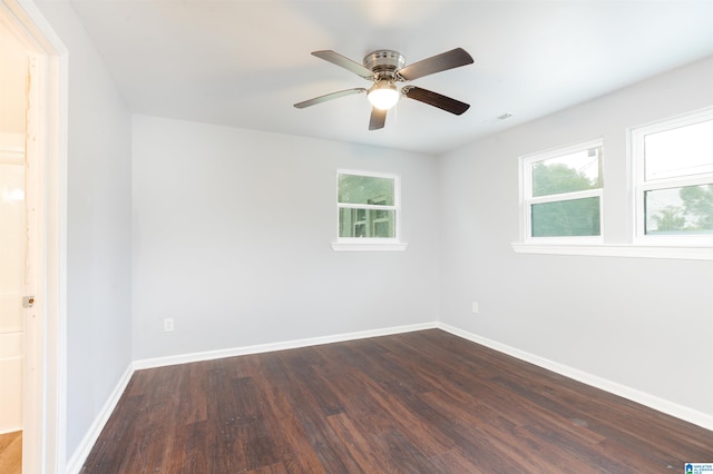 unfurnished room with ceiling fan and dark hardwood / wood-style floors