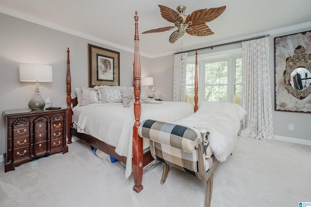 carpeted bedroom with ceiling fan and crown molding