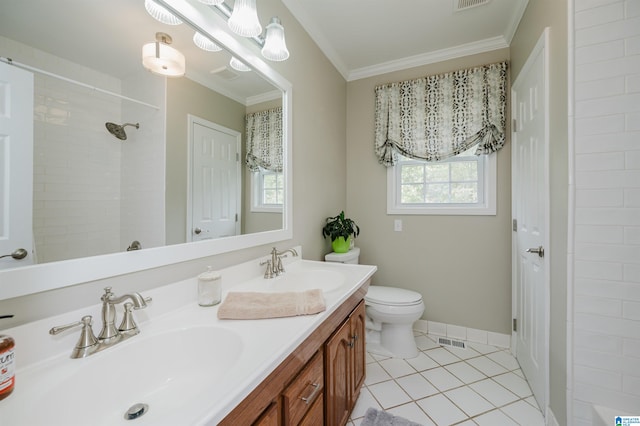 bathroom featuring vanity, tiled shower, tile patterned floors, crown molding, and toilet