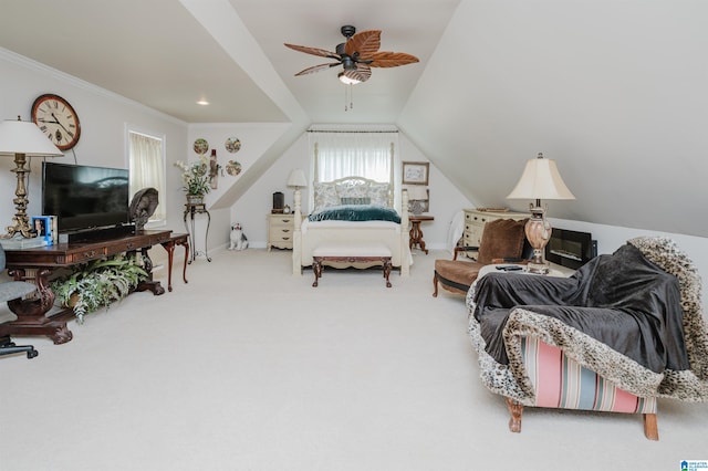 carpeted bedroom featuring vaulted ceiling, ceiling fan, and crown molding