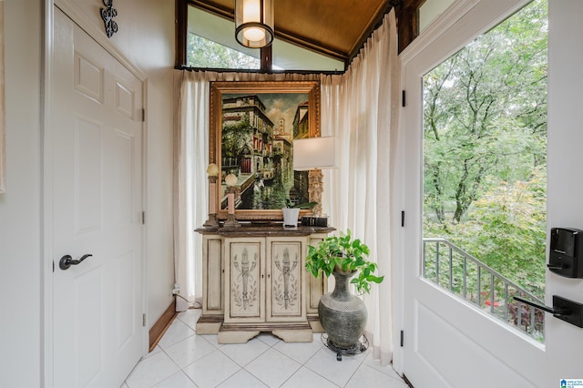 interior space featuring a wealth of natural light and vaulted ceiling