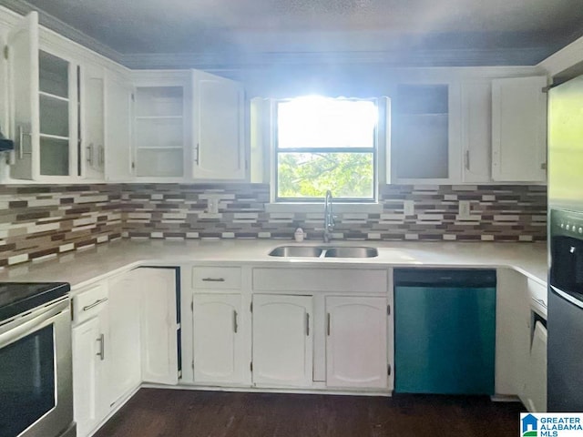 kitchen with white cabinets, appliances with stainless steel finishes, backsplash, and sink