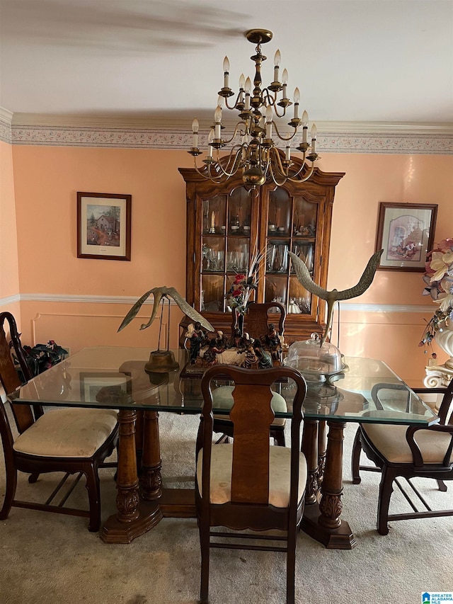 dining room with crown molding and carpet flooring