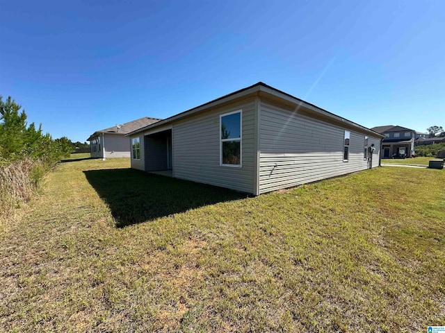 view of property exterior with a lawn