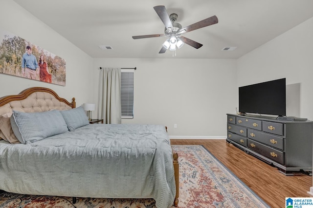 bedroom featuring hardwood / wood-style flooring and ceiling fan