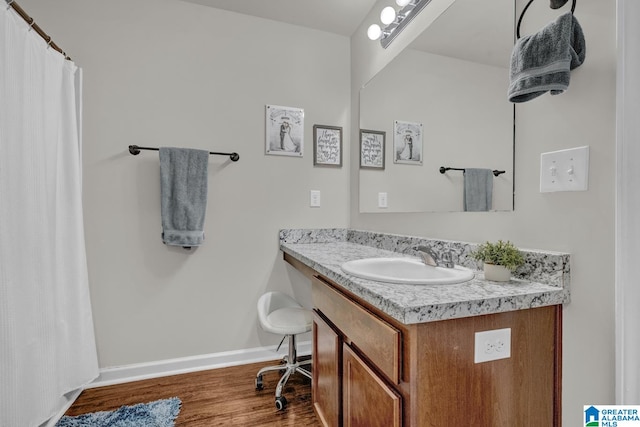 bathroom featuring hardwood / wood-style floors and vanity