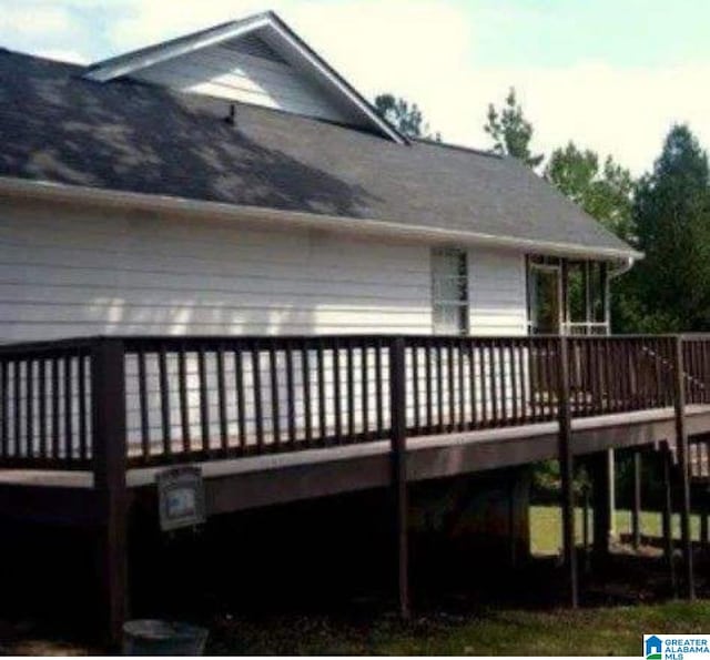 rear view of property with a deck