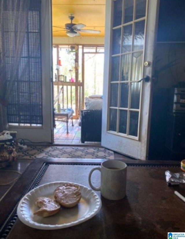 doorway to outside featuring ceiling fan