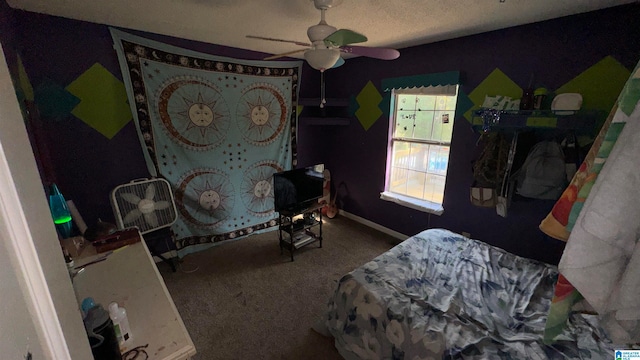 bedroom featuring ceiling fan, carpet floors, and a textured ceiling