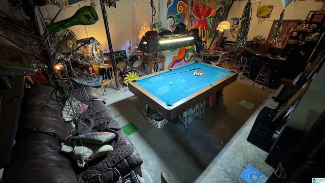 recreation room with concrete flooring and billiards