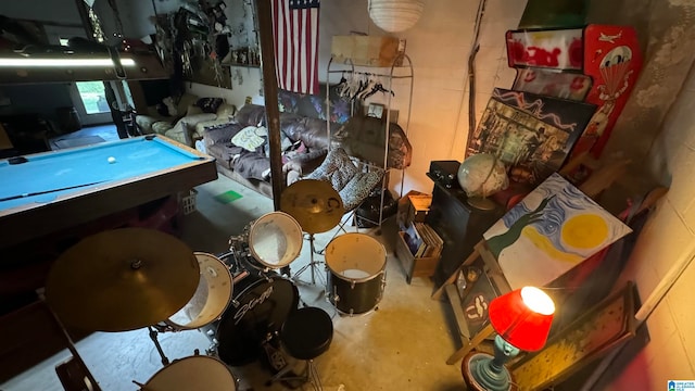 miscellaneous room featuring concrete flooring and billiards