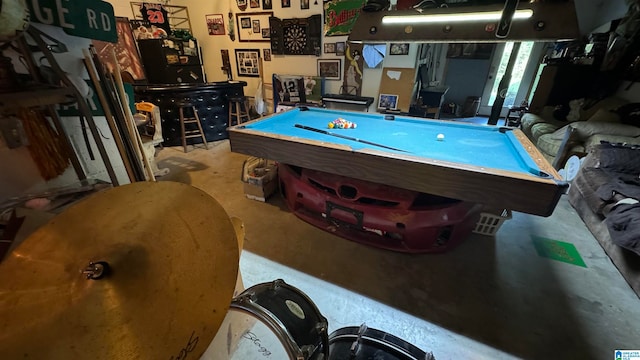 interior space with pool table and concrete floors