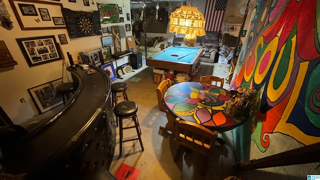 recreation room featuring concrete floors