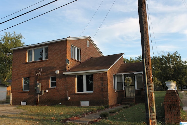 view of property exterior with a lawn