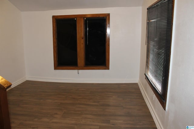 spare room featuring dark hardwood / wood-style flooring