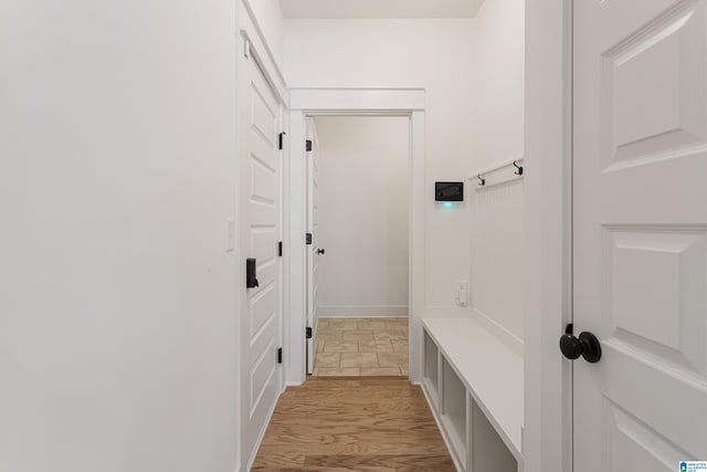 mudroom with light hardwood / wood-style floors