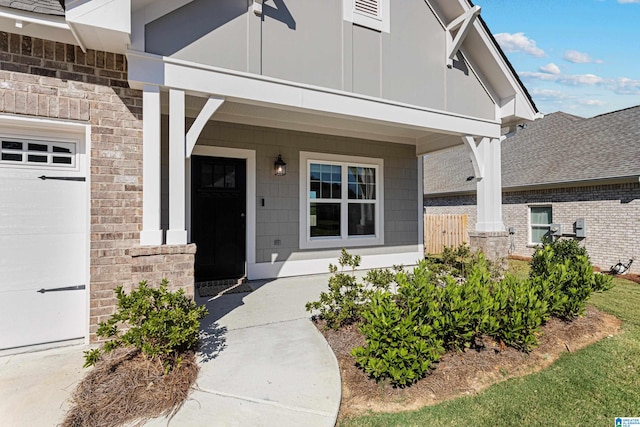 view of exterior entry featuring a garage