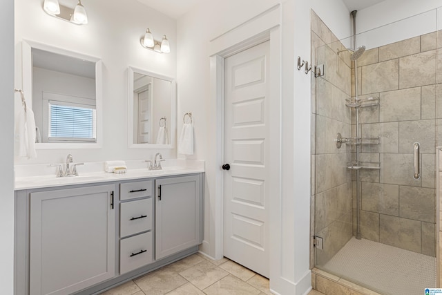 bathroom featuring vanity, tile patterned flooring, and an enclosed shower