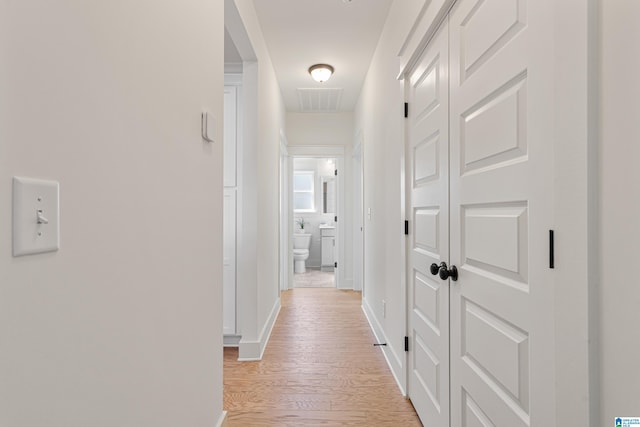 hallway featuring light wood-type flooring