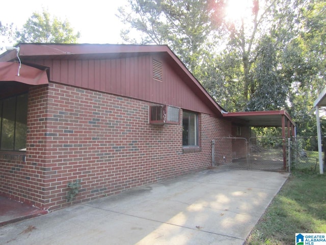 view of property exterior with a carport