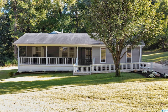 view of front of home with a front yard and a porch