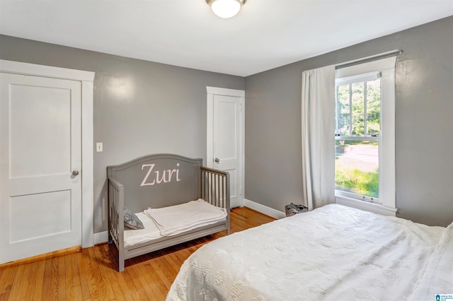 bedroom with wood-type flooring