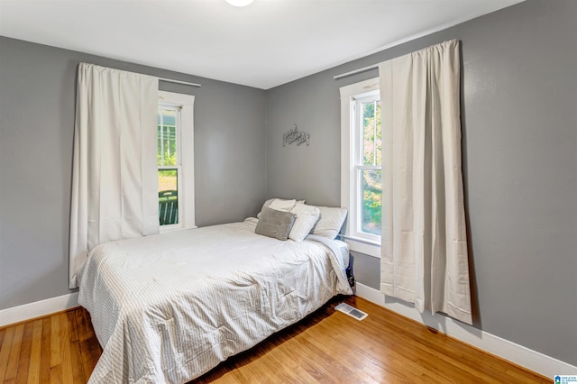 bedroom featuring wood-type flooring