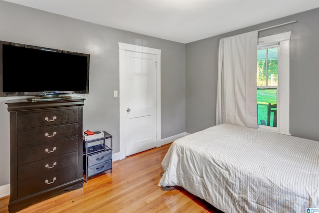 bedroom with light wood-type flooring