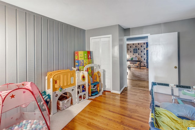 game room with light wood-type flooring