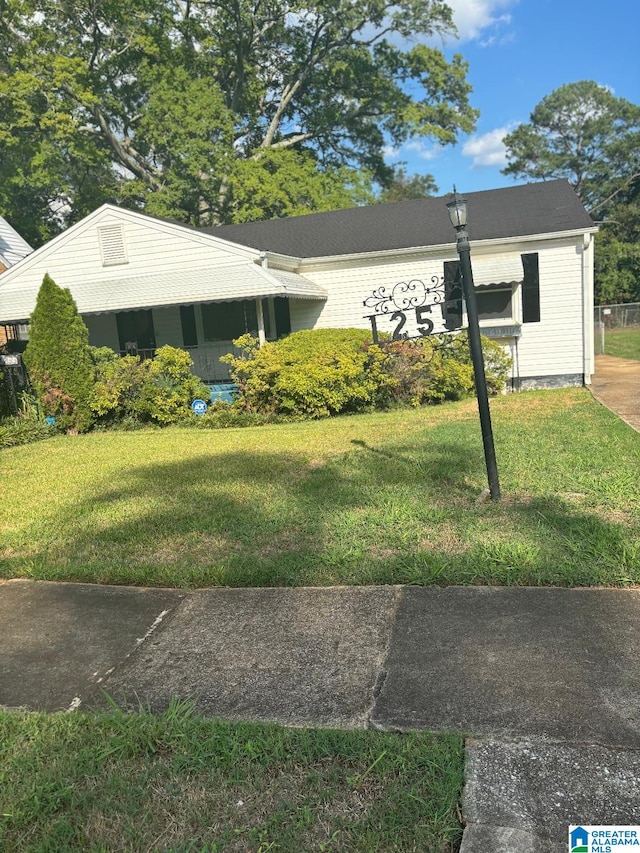 view of home's exterior with a lawn