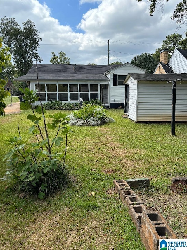 view of yard featuring a sunroom