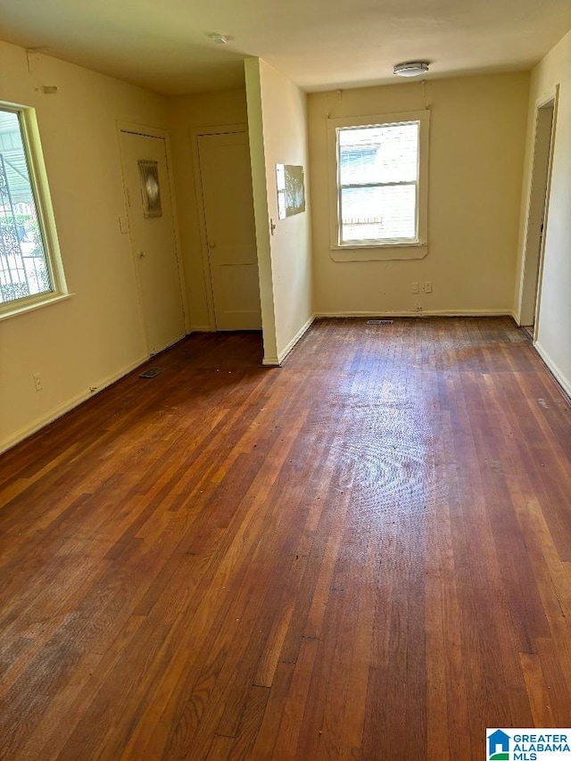 empty room featuring dark hardwood / wood-style floors