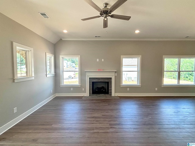 unfurnished living room with ceiling fan, ornamental molding, plenty of natural light, and dark wood-type flooring