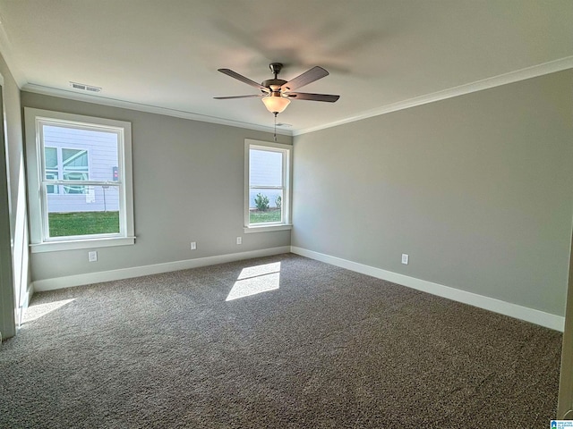 empty room featuring ceiling fan, crown molding, and carpet